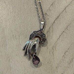 Elegant Silver Necklace with Purple Gemstone Hand Pendant